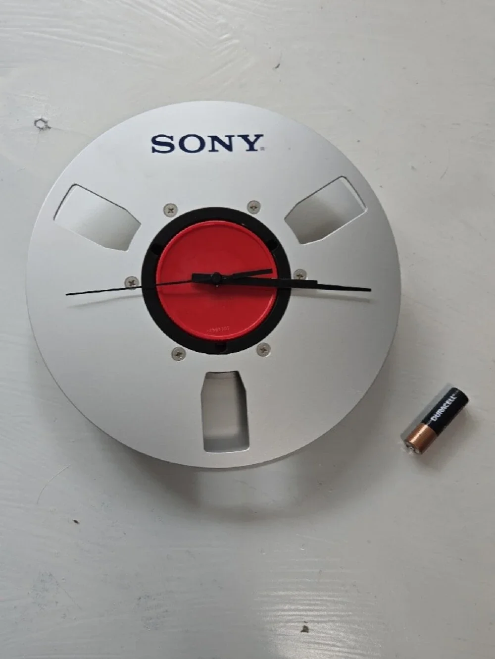 Sony Silver and Red Reel-Style Wall Clock